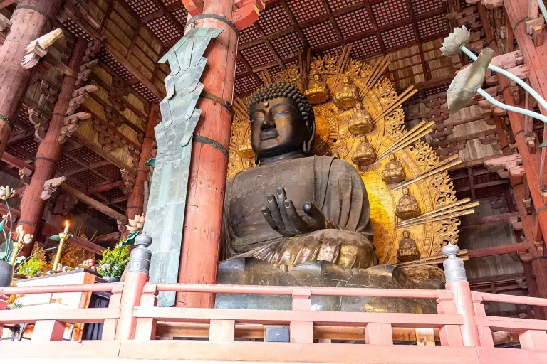 The bronze Great Buddha of Tōdai-ji seated inside the Great Buddha Hall
