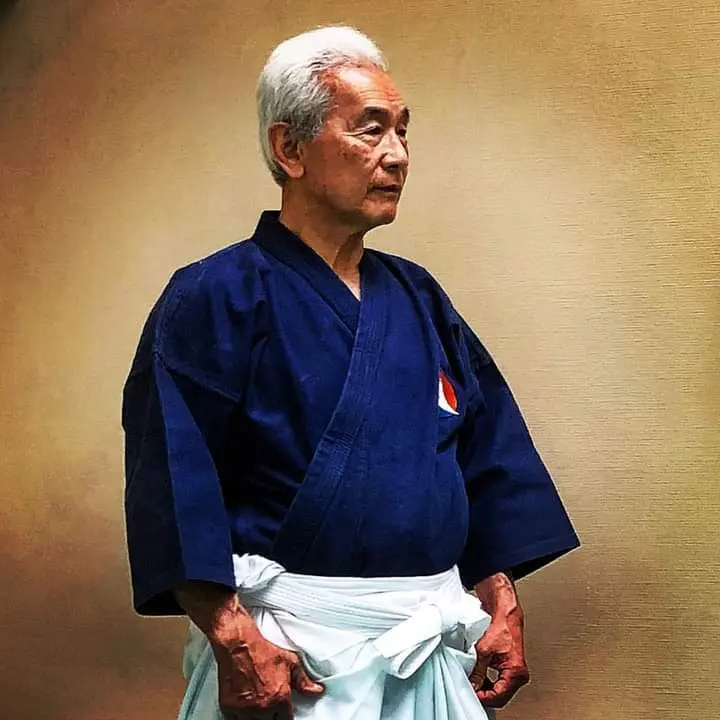 Portrait of Hiroo Mochizuki wearing a dark jacket