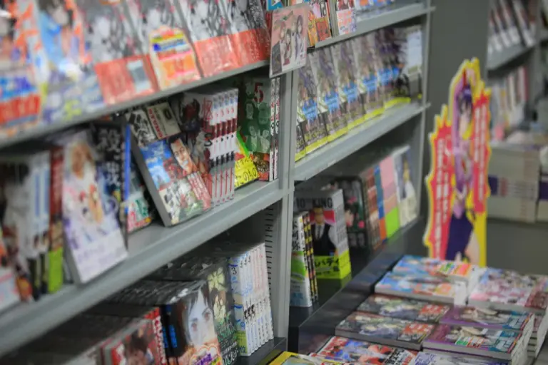 Rows of collected manga book volumes arranged on bookshelves