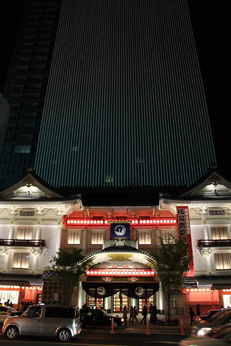 White traditional-style facade of Kabuki-za with Kabukiza Tower rising behind it in Ginza