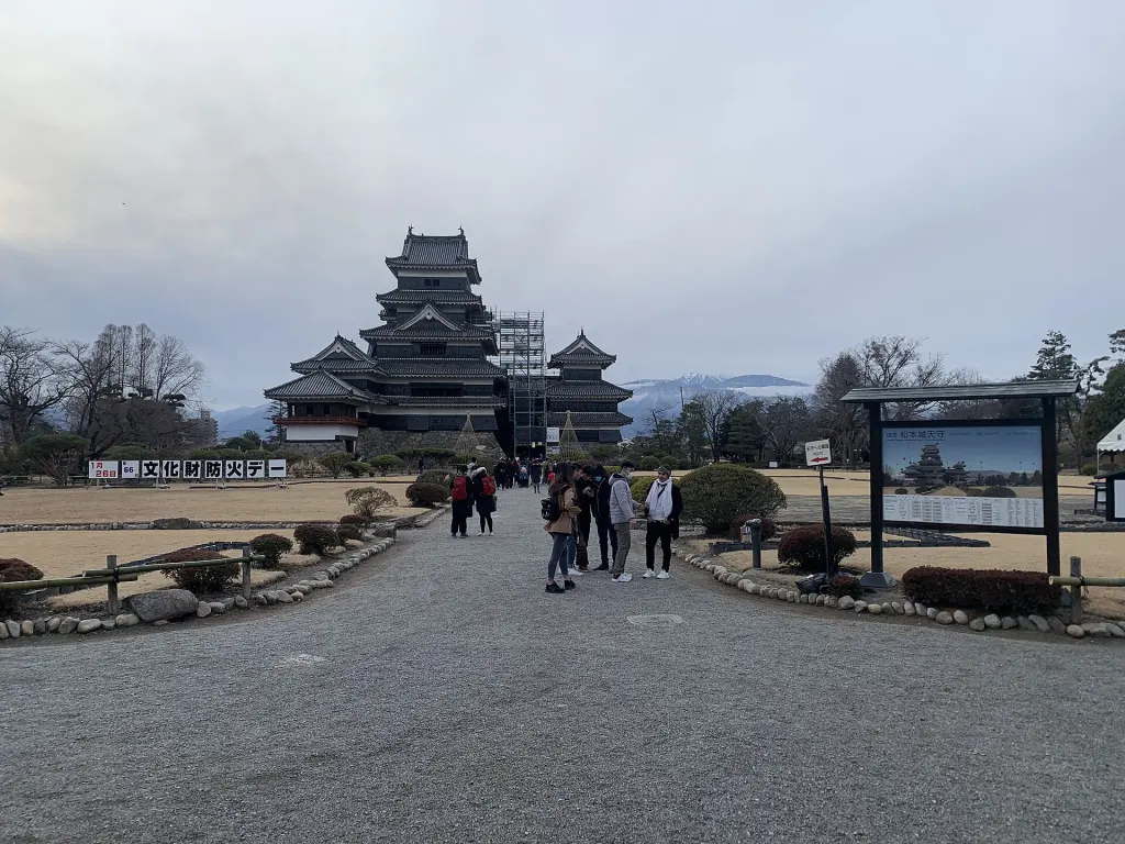 Matsumoto Castle’s black-and-white keep beyond the approach and courtyard.