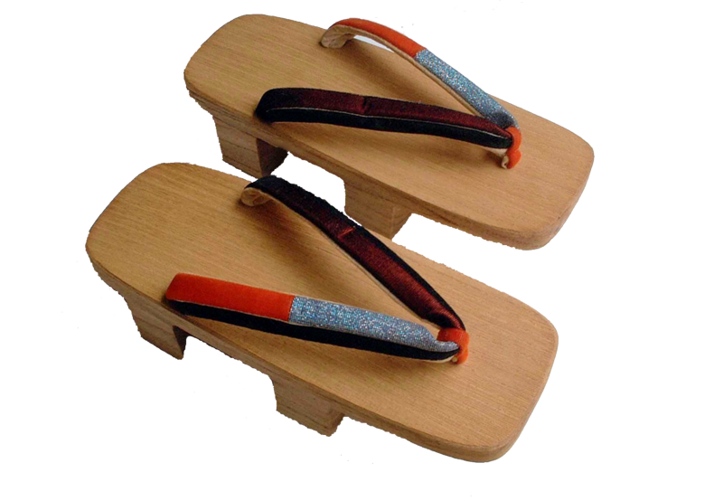Pair of wooden Japanese geta with two raised teeth and patterned thongs