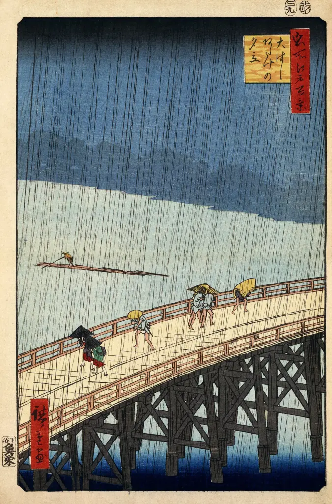 People crossing a bridge in slanting rain in a woodblock print by Utagawa Hiroshige