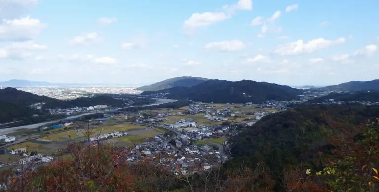 Wooded hills and a plain seen from Ichinomiya Castle ruins.