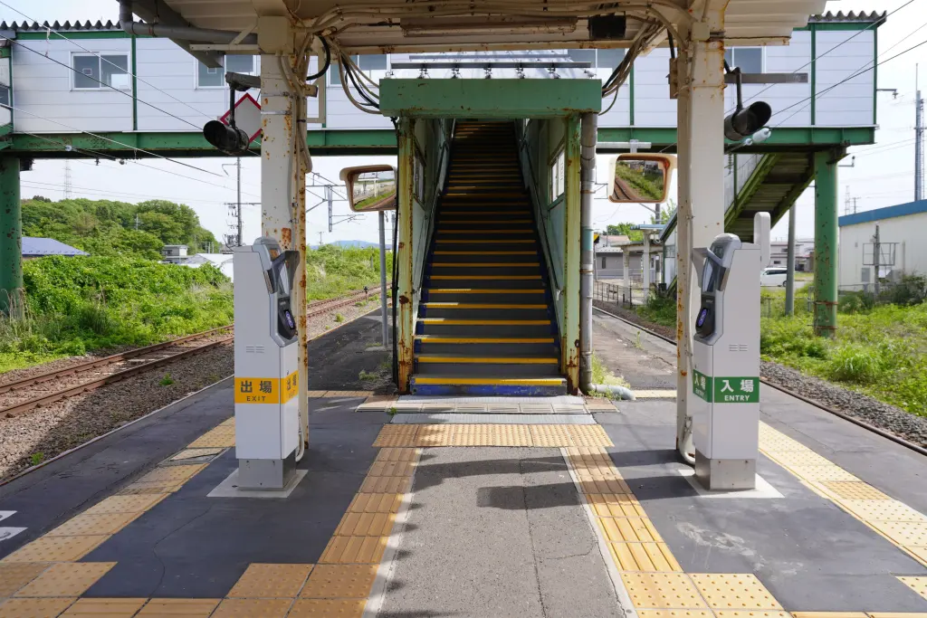 JR East simple Suica card reader beside a station entrance in Akita