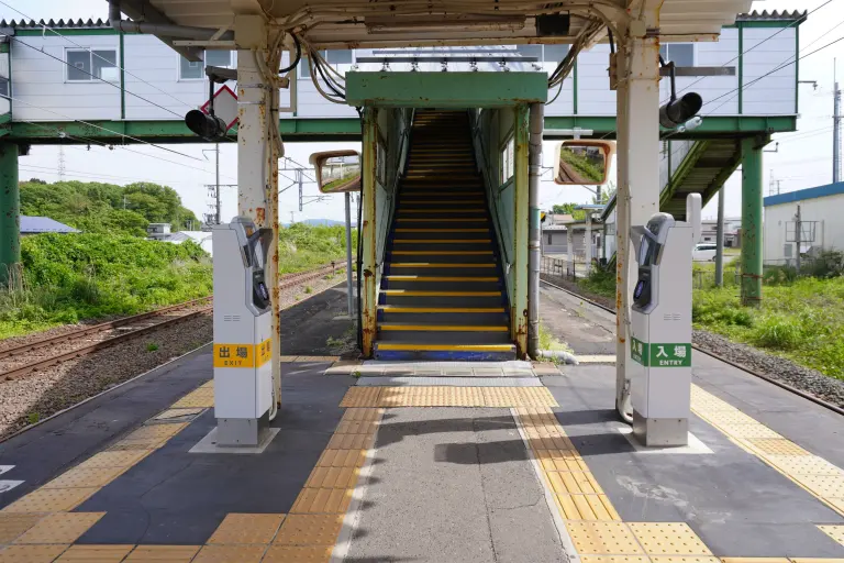 JR East simple Suica card reader beside a station entrance in Akita