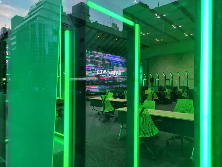 Building exterior displaying esports high-school signage.