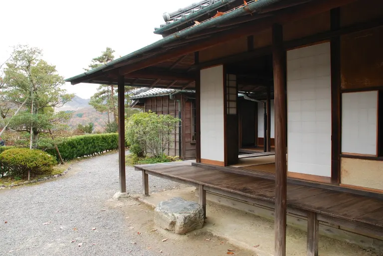 Wooden engawa running beside sliding screens at a traditional Japanese house