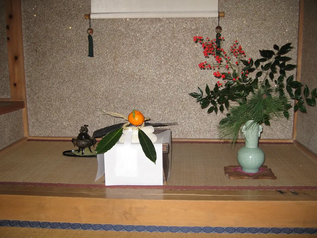 Two round rice cakes stacked as kagami mochi in a tokonoma