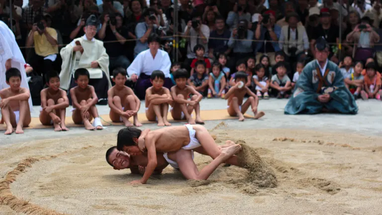 Children wrestle in the Karasu-zumo ring before the Hosodono at Kamigamo Jinja