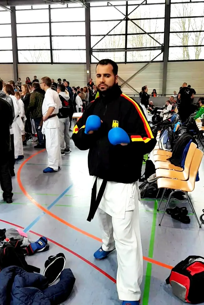 Two competitors engage in kumite at a Karate championship