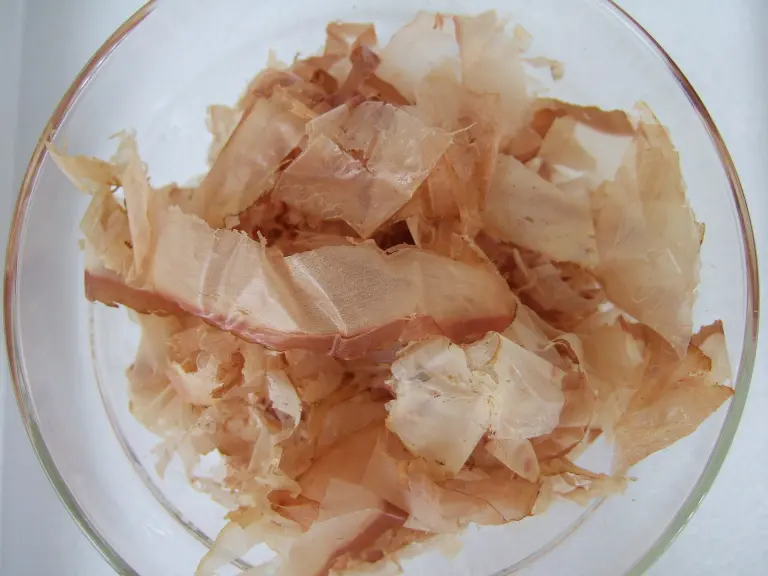 A mound of pale pink and tan katsuobushi shavings