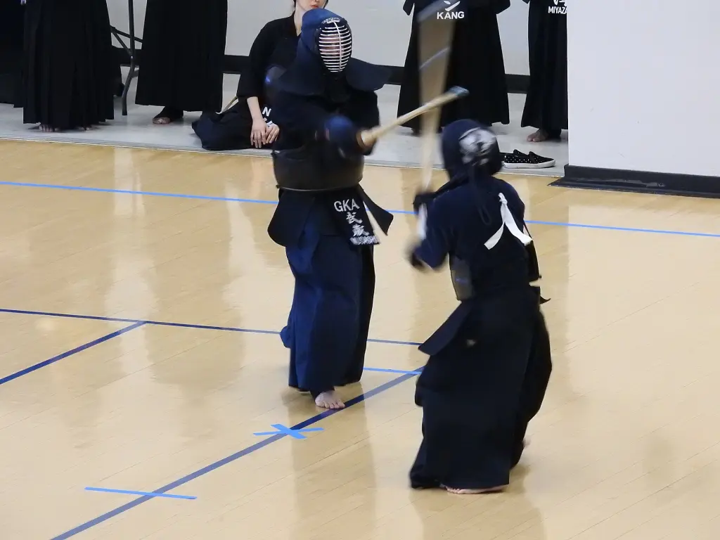 Two Kendo practitioners during a men strike exchange