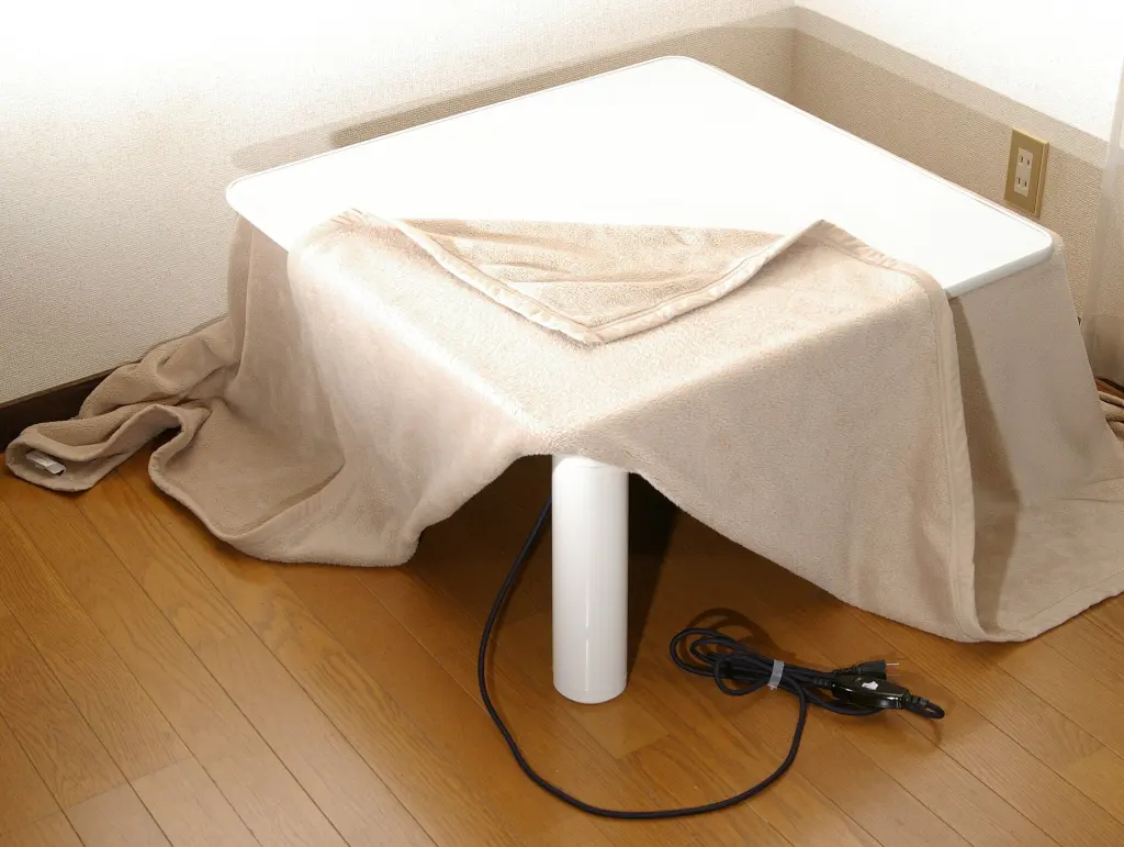 Modern electric kotatsu with a patterned quilt and wooden tabletop