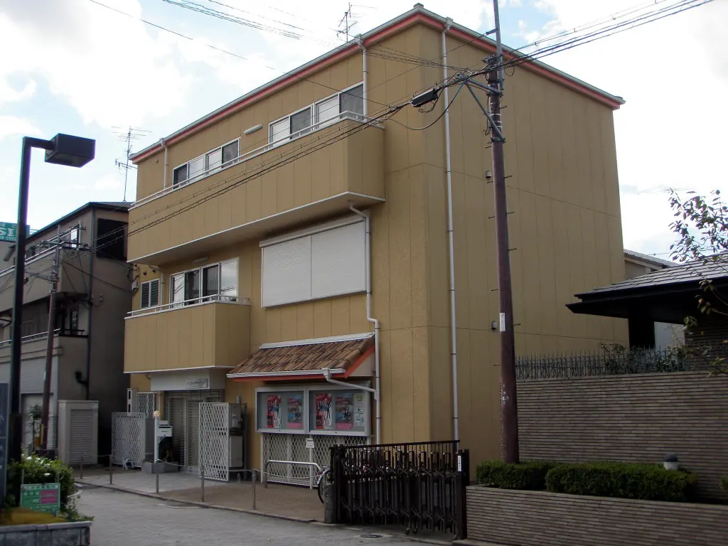 Low-rise Kyoto Animation office building on a street in Uji