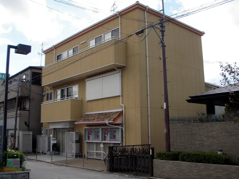 Low-rise Kyoto Animation office building on a street in Uji
