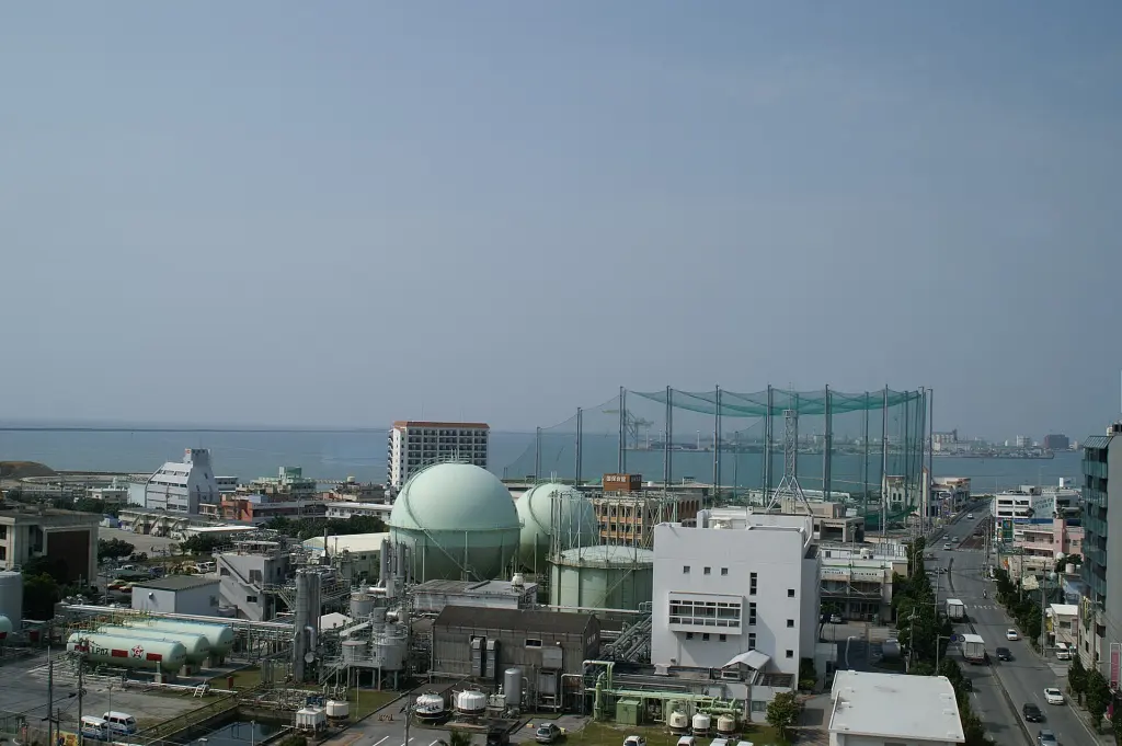 Wide view of Naha Port with harbor water, ships, and city buildings