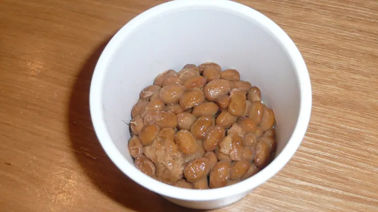 A serving of sticky fermented soybeans in a small container