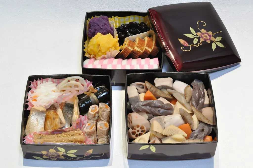 Assorted osechi ryōri arranged in compartments of a jūbako box