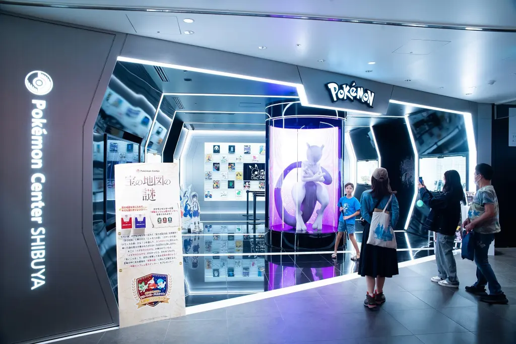 Visitors among colorful Pokémon character displays inside Pokémon Center Shibuya