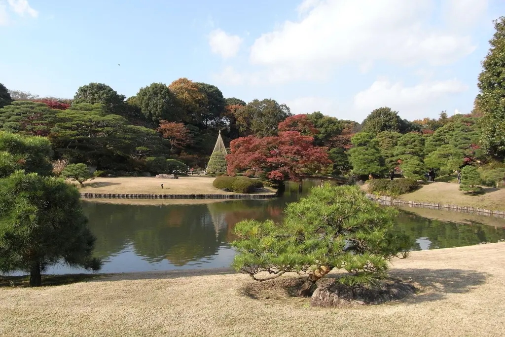 Pond and tree-covered shoreline in Rikugien Garden, Tokyo