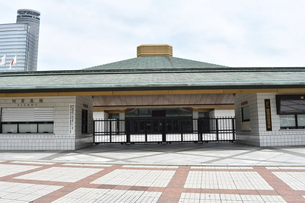 Exterior of Ryogoku Kokugikan with its broad green roof and entrance plaza
