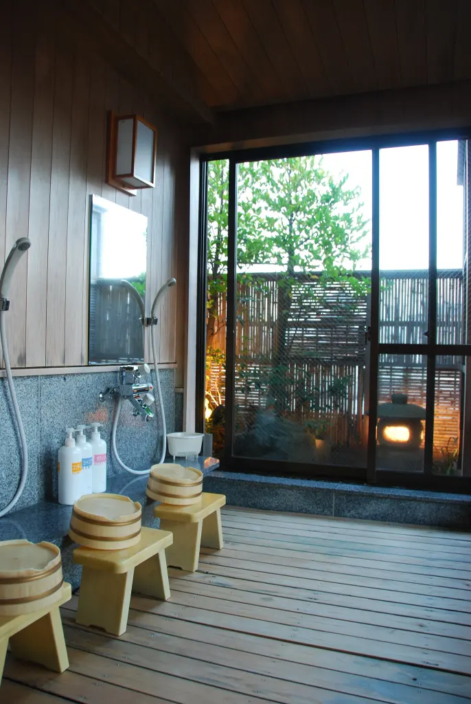 Low stools, buckets, taps, and showers in a Japanese communal bathing room