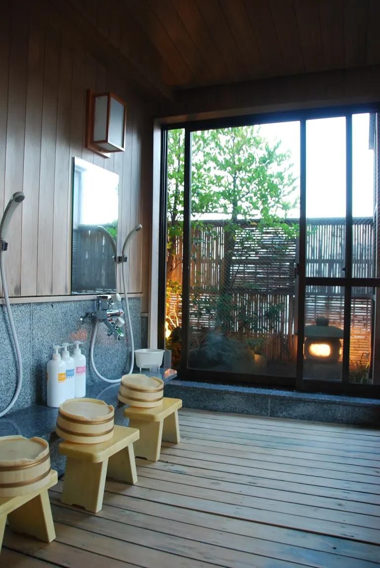 Low stools, buckets, taps, and showers in a Japanese communal bathing room