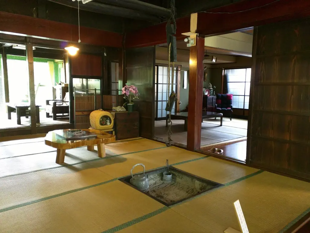Timber-framed interior of a traditional Japanese farmhouse in Niigata