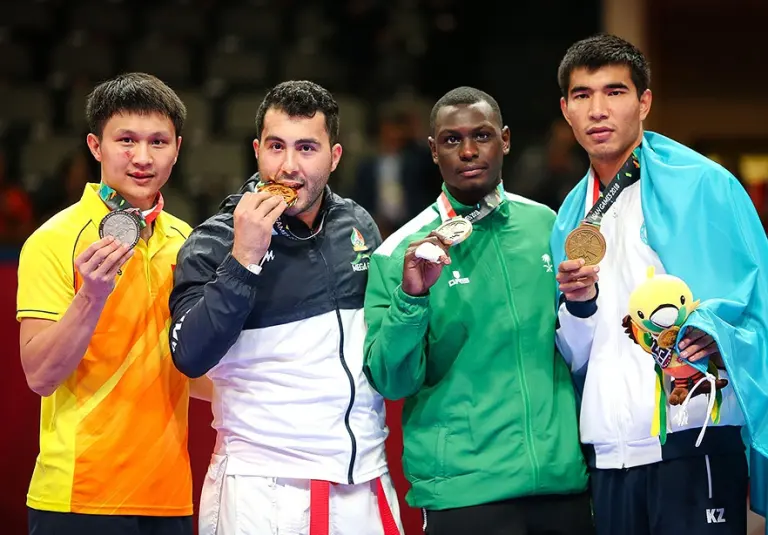 Karate athletes competing in the men's over 84 kilogram kumite event at the 2018 Asian Games